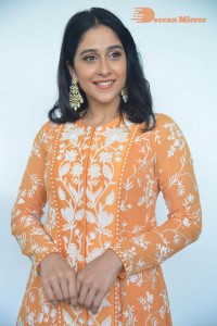 Actress Regina Cassandra Actress poses in a Orange Dress for a Photoshoot