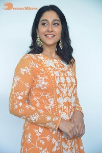 Actress Regina Cassandra Actress poses in a Orange Dress for a Photoshoot