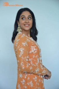Actress Regina Cassandra Actress poses in a Orange Dress for a Photoshoot