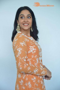 Actress Regina Cassandra Actress poses in a Orange Dress for a Photoshoot