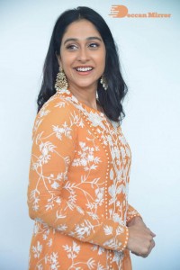 Actress Regina Cassandra Actress poses in a Orange Dress for a Photoshoot