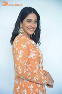 Actress Regina Cassandra Actress poses in a Orange Dress for a Photoshoot