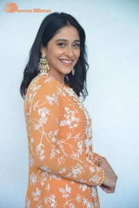 Actress Regina Cassandra Actress poses in a Orange Dress for a Photoshoot