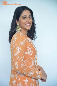 Actress Regina Cassandra Actress poses in a Orange Dress for a Photoshoot