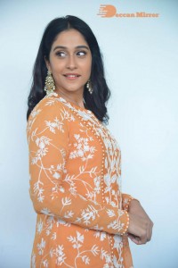 Actress Regina Cassandra Actress poses in a Orange Dress for a Photoshoot