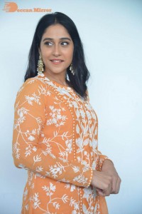 Actress Regina Cassandra Actress poses in a Orange Dress for a Photoshoot