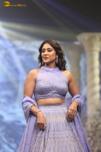 actress regina cassandra in a purple lehenga choli doing a ramp walk