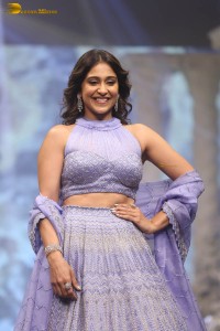 actress regina cassandra in a purple lehenga choli doing a ramp walk
