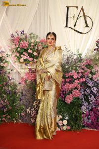veteran bollywood actress rekha dazzles in a gold color saree