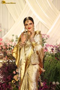 veteran bollywood actress rekha dazzles in a gold color saree