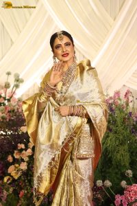 veteran bollywood actress rekha dazzles in a gold color saree