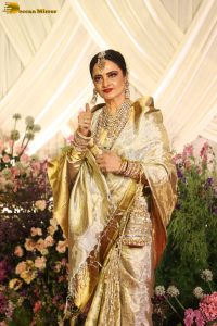 veteran bollywood actress rekha dazzles in a gold color saree