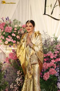 veteran bollywood actress rekha dazzles in a gold color saree