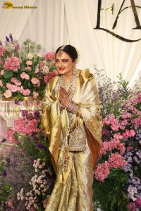 veteran bollywood actress rekha dazzles in a gold color saree