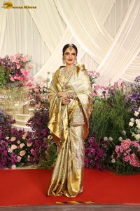 veteran bollywood actress rekha dazzles in a gold color saree