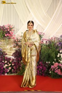 veteran bollywood actress rekha dazzles in a gold color saree