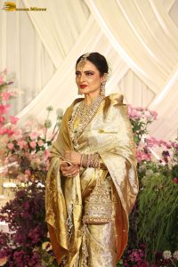 veteran bollywood actress rekha dazzles in a gold color saree