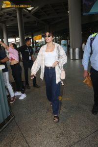 actress Rhea Chakraborty stylish in shirt and sunglasses