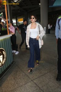 actress Rhea Chakraborty stylish in shirt and sunglasses