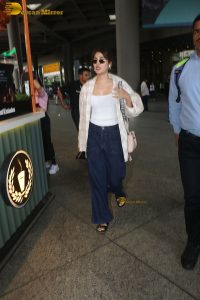 actress Rhea Chakraborty stylish in shirt and sunglasses