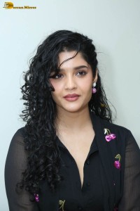 actress ritika singh in a black midi dress