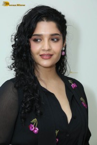 actress ritika singh in a black midi dress