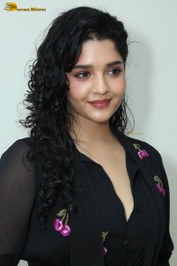 actress ritika singh in a black midi dress