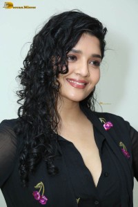 actress ritika singh in a black midi dress
