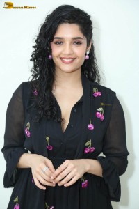 actress ritika singh in a black midi dress