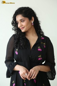actress ritika singh in a black midi dress
