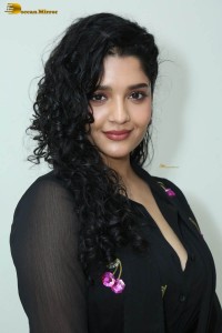 actress ritika singh in a black midi dress