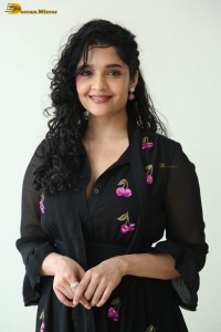 actress ritika singh in a black midi dress