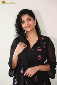 actress ritika singh in a black midi dress