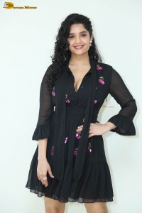 actress ritika singh in a black midi dress