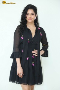 actress ritika singh in a black midi dress