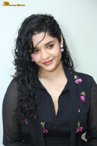 actress ritika singh in a black midi dress