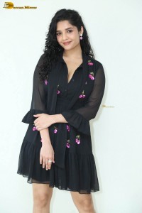 actress ritika singh in a black midi dress