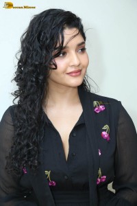 actress ritika singh in a black midi dress