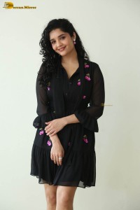 actress ritika singh in a black midi dress