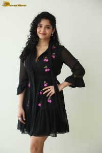 actress ritika singh in a black midi dress