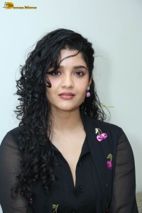 actress ritika singh in a black midi dress