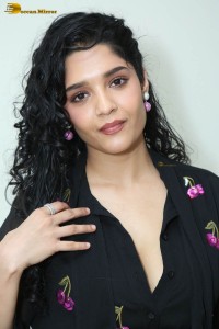 actress ritika singh in a black midi dress