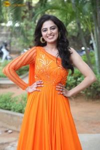 indian actress roshni sahota glamorous in a shoulderless orange dress