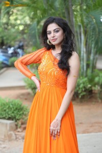 indian actress roshni sahota glamorous in a shoulderless orange dress