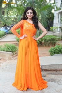 indian actress roshni sahota glamorous in a shoulderless orange dress