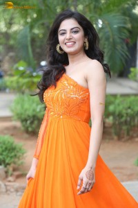 indian actress roshni sahota glamorous in a shoulderless orange dress