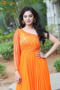 indian actress roshni sahota glamorous in a shoulderless orange dress