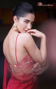 Actress Ruhani Sharma poses sensually in a Red Saree