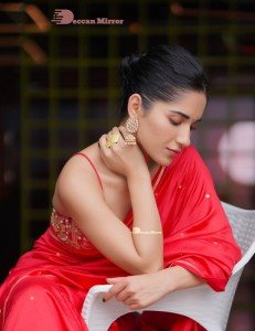 Actress Ruhani Sharma poses sensually in a Red Saree