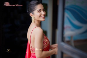 Actress Ruhani Sharma poses sensually in a Red Saree